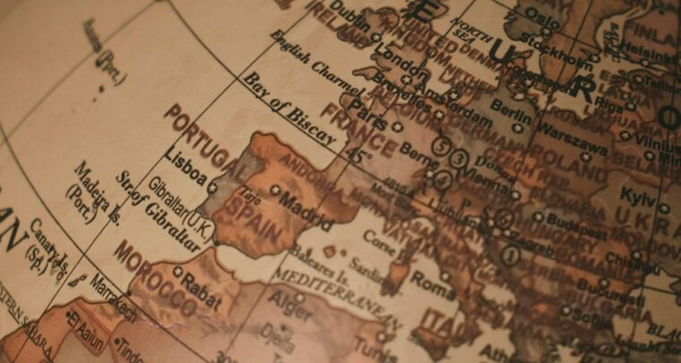 Close-up of a classic globe, centered on Europe and surrounding regions, with visible city and country names. European Union